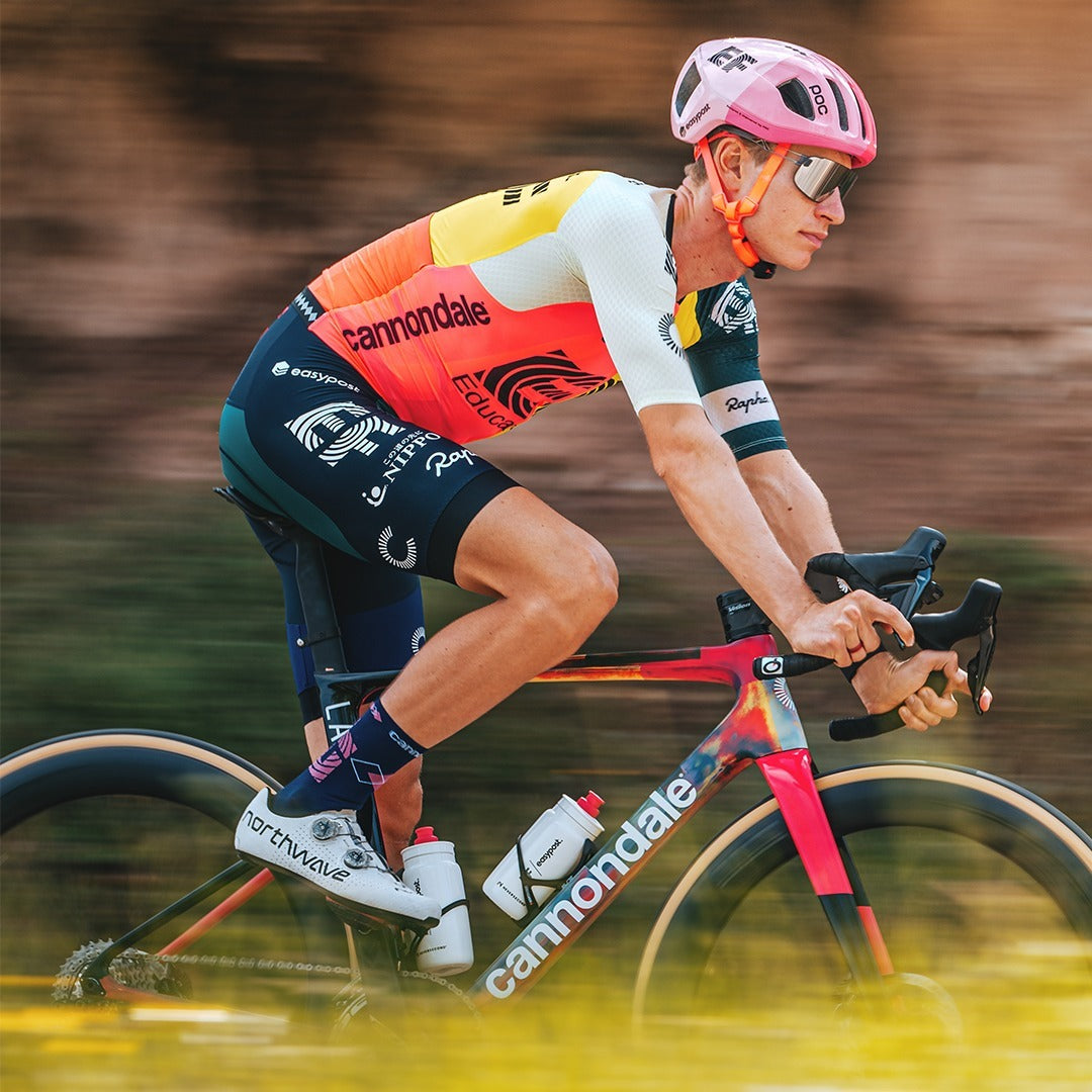 A man cyclist is riding a Canondale road bicycle.